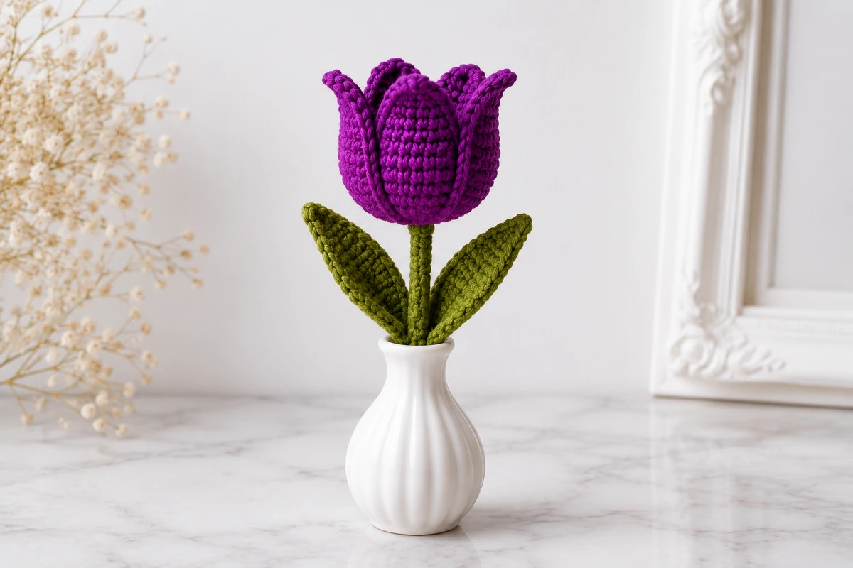 amigurumi crochet tulip free pattern in minimalist setting standing upright in vase